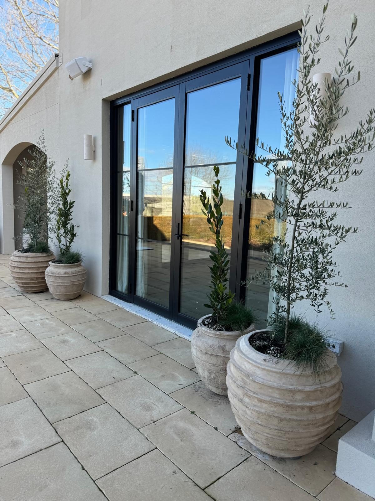 Shaw Estate patio with black-framed glass bi-fold doors